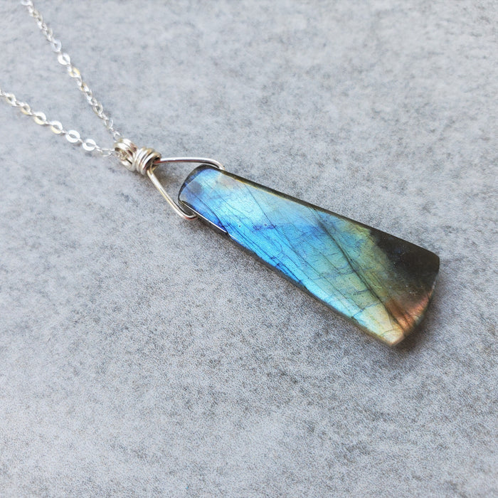 Labradorite stone hanging from sterling silver chain