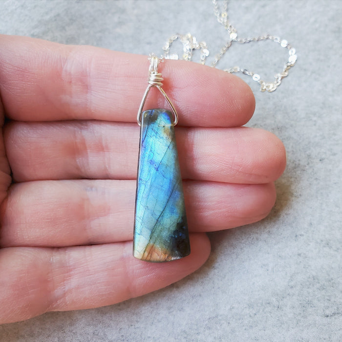 Labradorite stone hanging from sterling silver chain