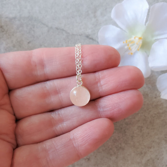 Bezel set rose quartz pendant on sterling silver chain