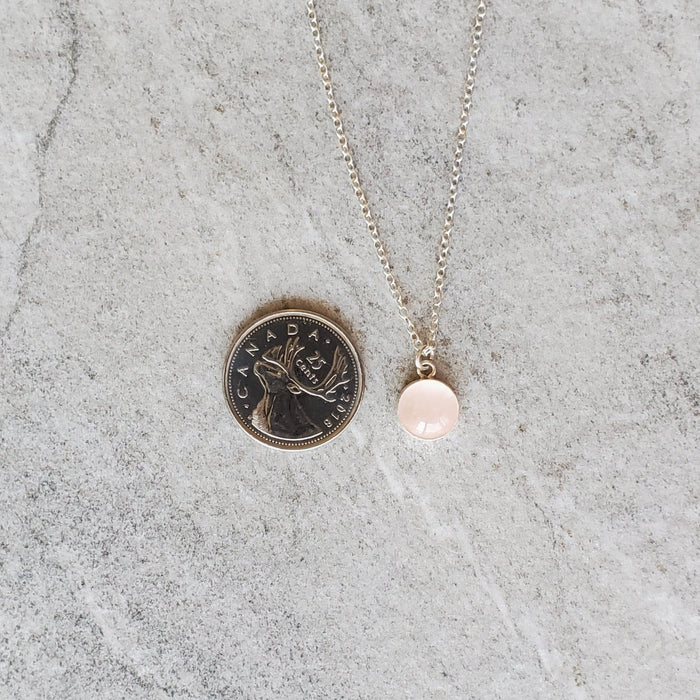 Bezel set rose quartz pendant on sterling silver chain