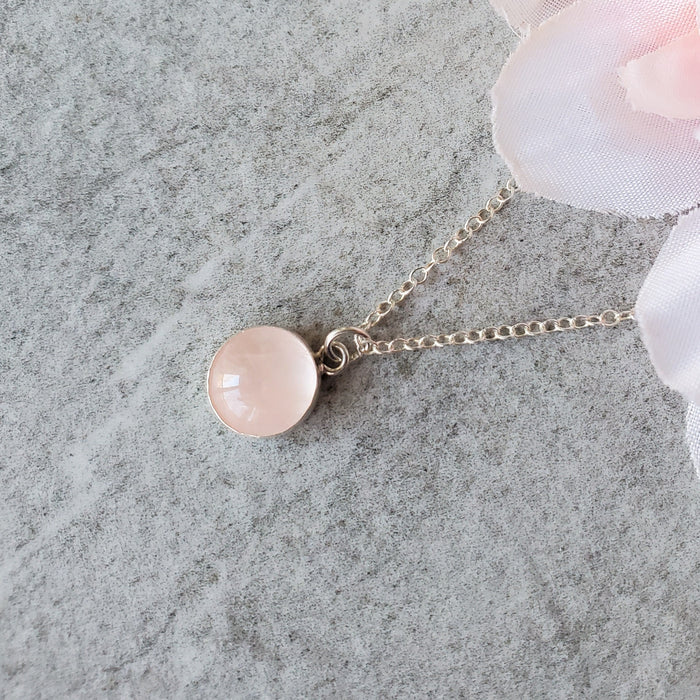 Bezel set rose quartz pendant on sterling silver chain