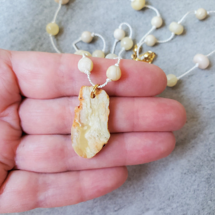 Hand knotted silk necklace featuring yellow opal nugget