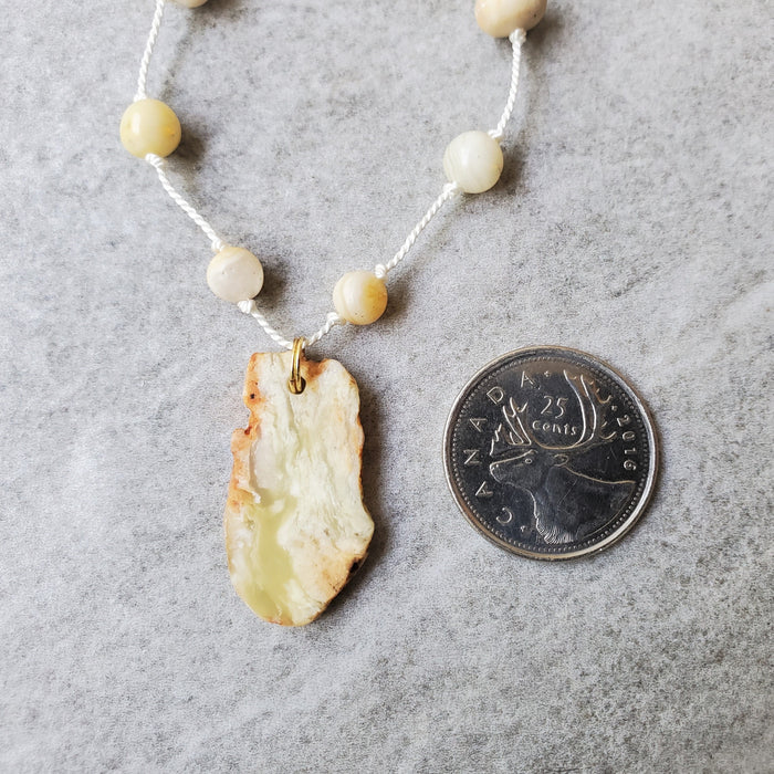 Hand knotted silk necklace featuring yellow opal nugget